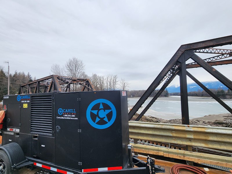 A Cahill unit set up next to a bridge in the mountains
