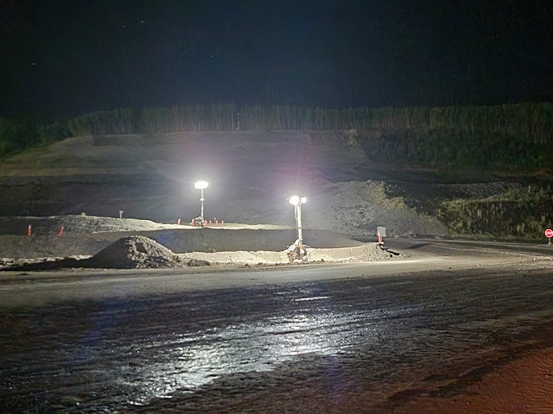 A gravel pit with light towers